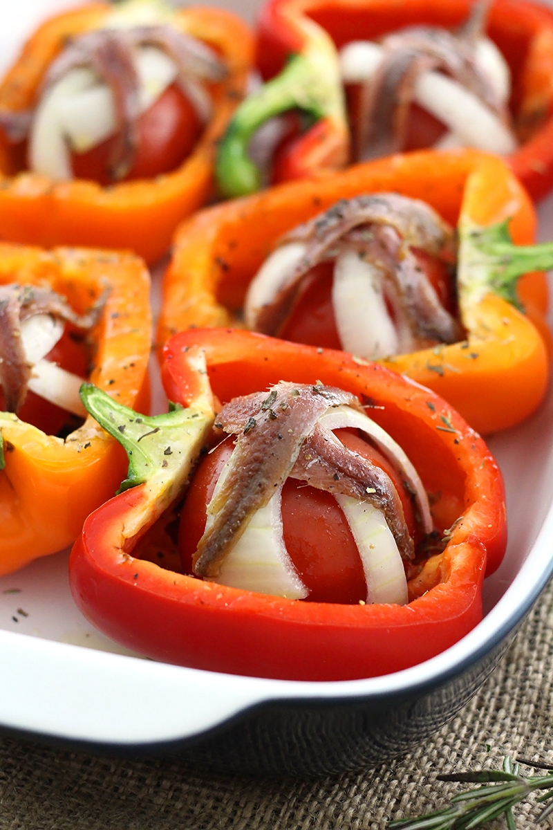 Tomato Garlic Stuffed Peppers are mouthwatering and packed with tomato, garlic, onion and lots of herbs and topped with anchovies!