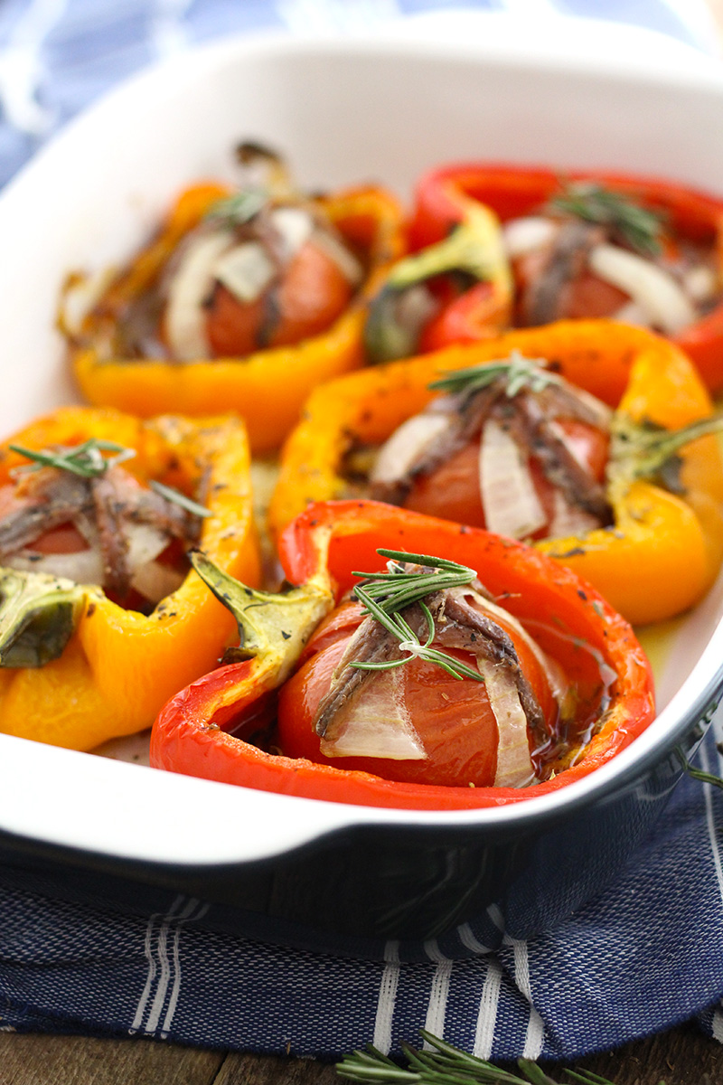 Tomato Garlic Stuffed Peppers are mouthwatering and packed with tomato, garlic, onion and lots of herbs and topped with anchovies!
