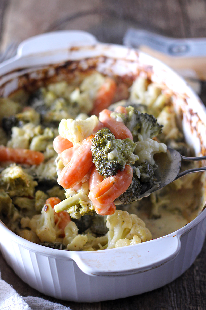 Creamy vegetable bake packed with carrots, broccoli, cauliflower, and lots of cheese!