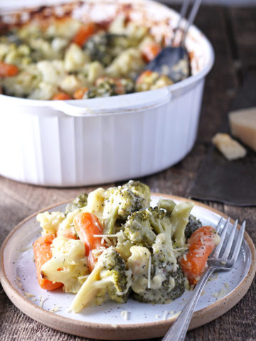 Creamy vegetable bake packed with carrots, broccoli, cauliflower, and lots of cheese!