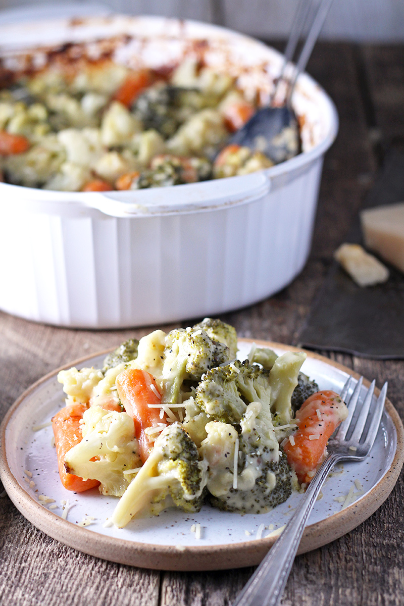 Creamy vegetable bake packed with carrots, broccoli, cauliflower, and lots of cheese!