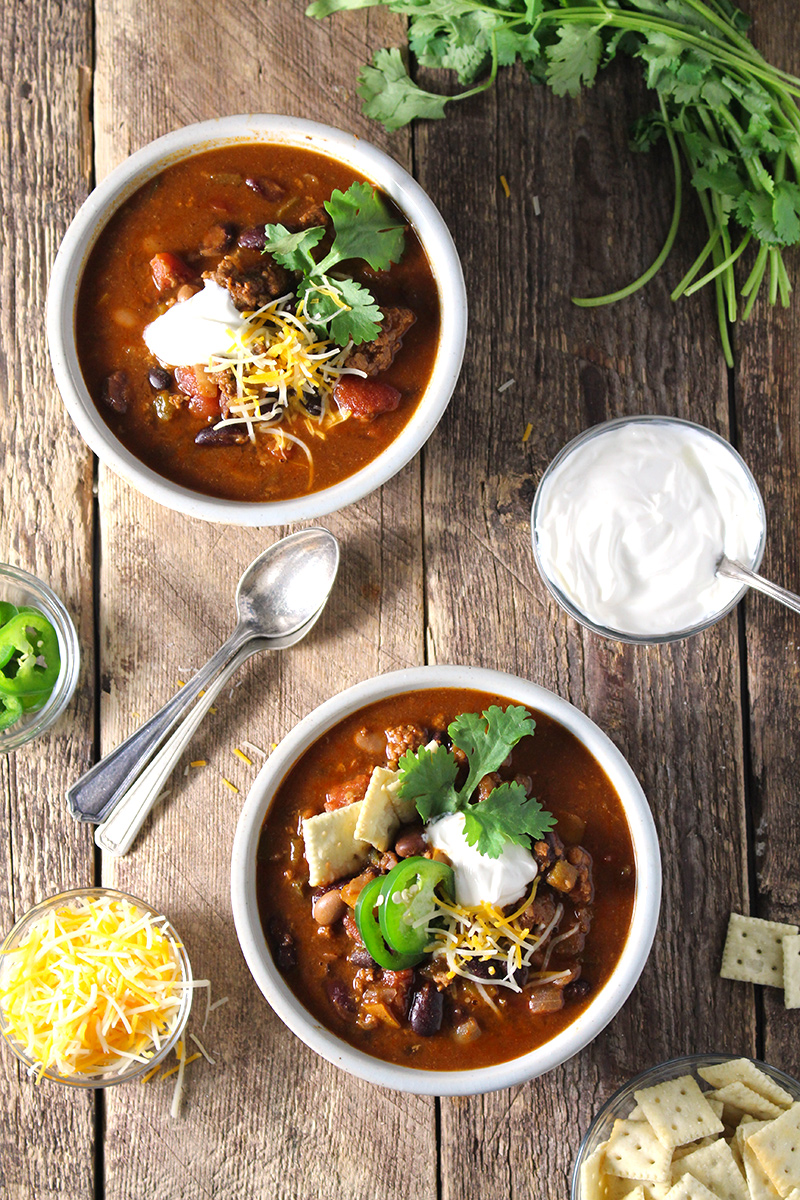 Hearty, easy-to-make chili with a kick! Loaded with five kinds of peppers from sweet to spicy, made with a full can of beer and homemade chili seasoning, and packed with beef and 4 kinds of beans.