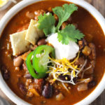 Hearty, easy-to-make chili with a kick! Loaded with five kinds of peppers from sweet to spicy, made with a full can of beer and homemade chili seasoning, and packed with beef and 4 kinds of beans.