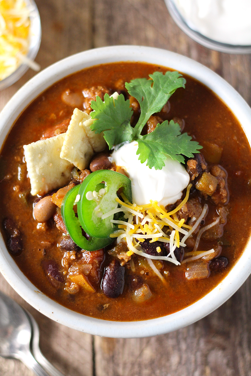 Hearty, easy-to-make chili with a kick! Loaded with five kinds of peppers from sweet to spicy, made with a full can of beer and homemade chili seasoning, and packed with beef and 4 kinds of beans. 