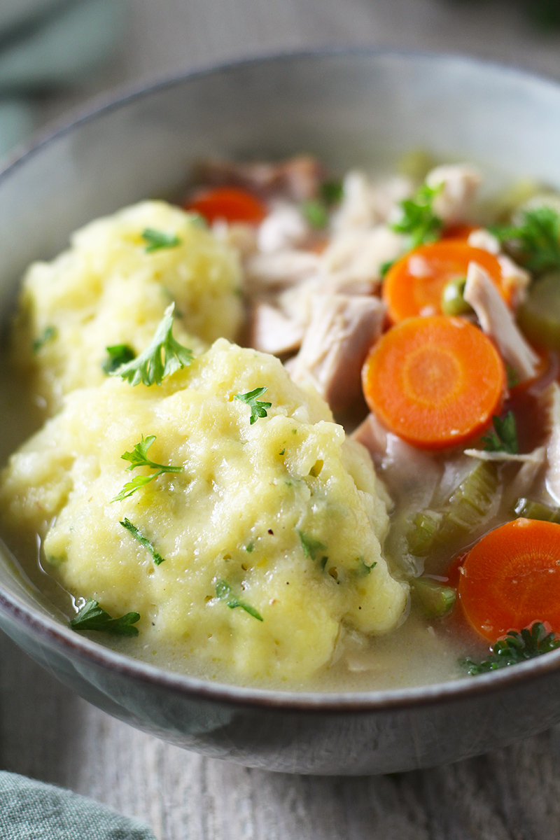 Classic, hearty version of Chicken and Dumplings Soup made from scratch using a whole chicken to make the tastiest broth. Easy-to-make, loaded with vegetables, and topped with fluffy homemade dumplings.