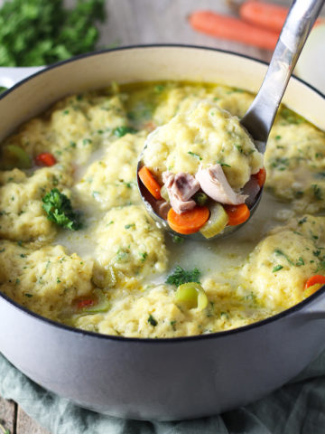 Classic, hearty version of Chicken and Dumplings Soup made from scratch using a whole chicken to make the tastiest broth. Easy-to-make, loaded with vegetables, and topped with fluffy homemade dumplings.