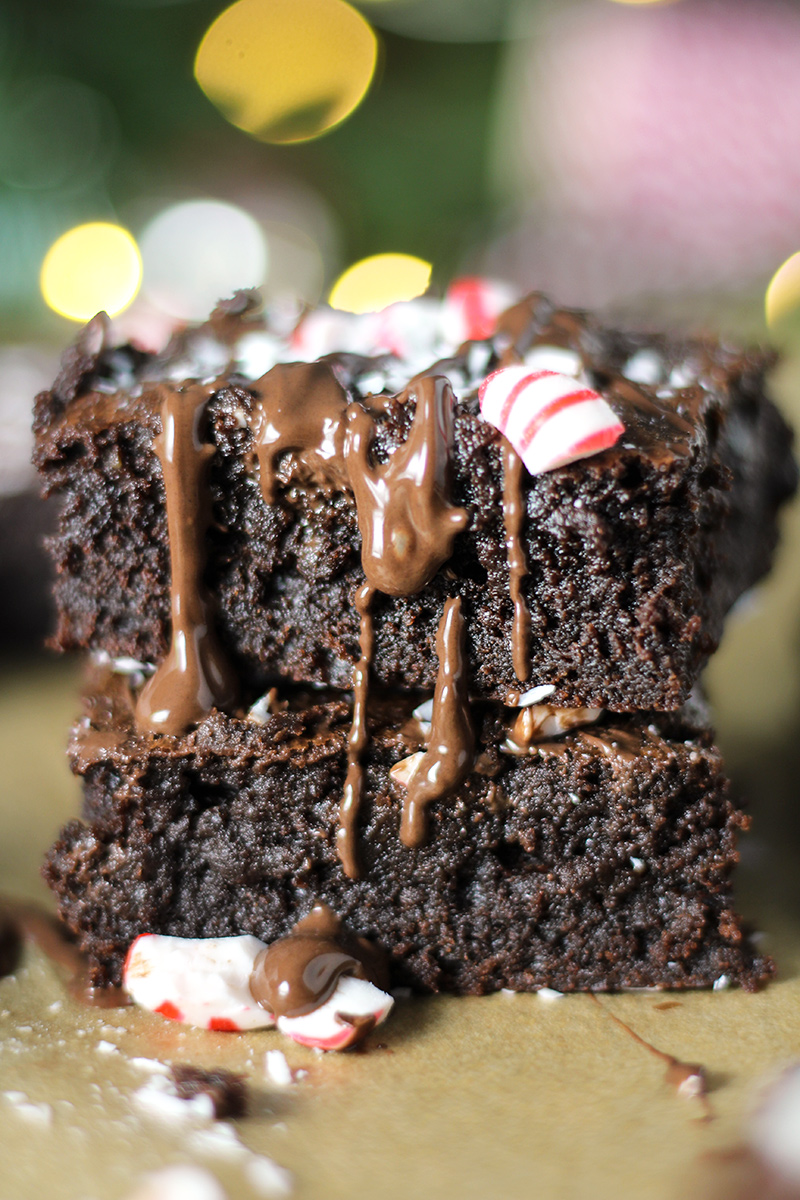 Fudgy Peppermint Mocha Brownies are the ultimate holiday treat! Rich and fudgy brownies infused with peppermint and espresso, drizzled with dark chocolate, and sprinkled with crushed peppermint candies.