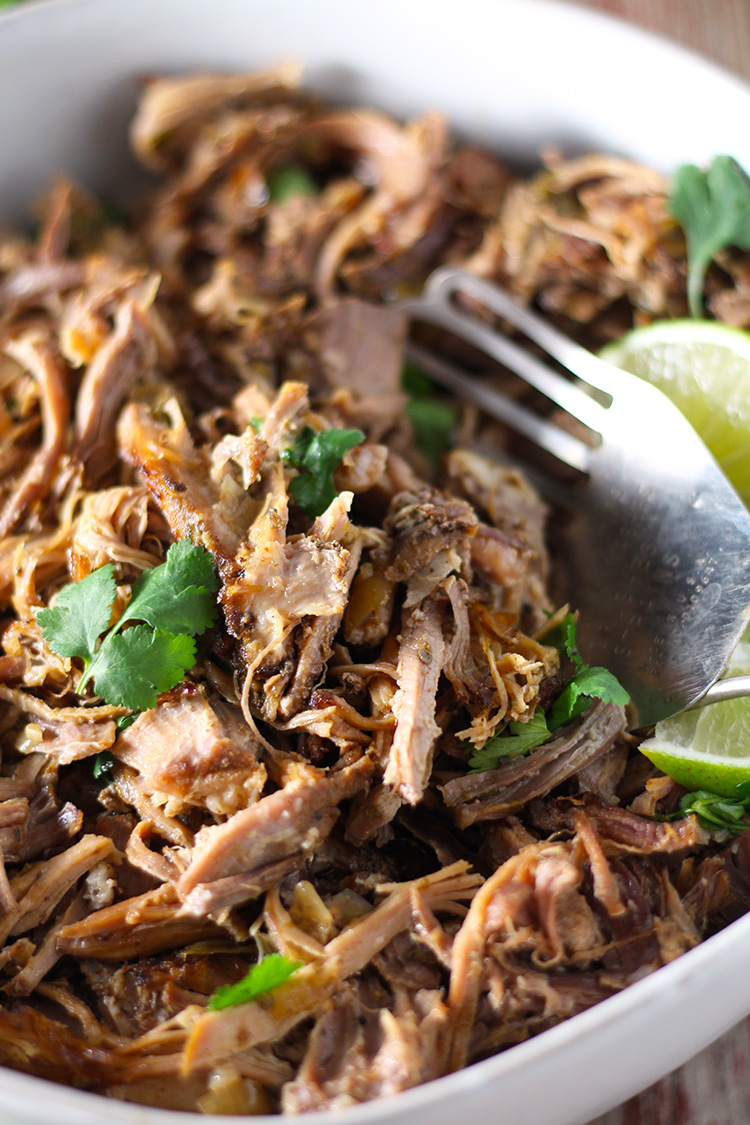 Incredibly tender Mexican slow cooker smoky pork carnitas are super easy to make and full of flavor. The meat is so juicy on the inside and perfectly crisp on the outside with two ways to achieve the perfect golden finish.