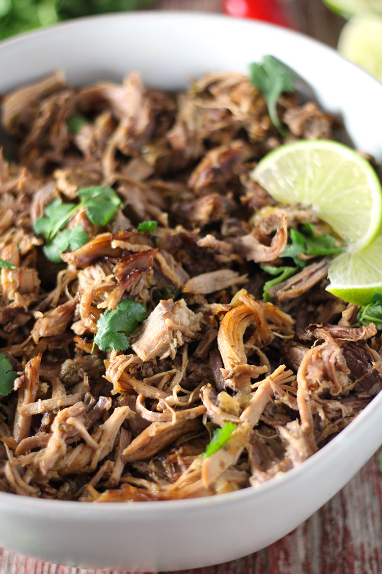 Incredibly tender Mexican slow cooker smoky pork carnitas are super easy to make and full of flavor. The meat is so juicy on the inside and perfectly crisp on the outside with two ways to achieve the perfect golden finish.