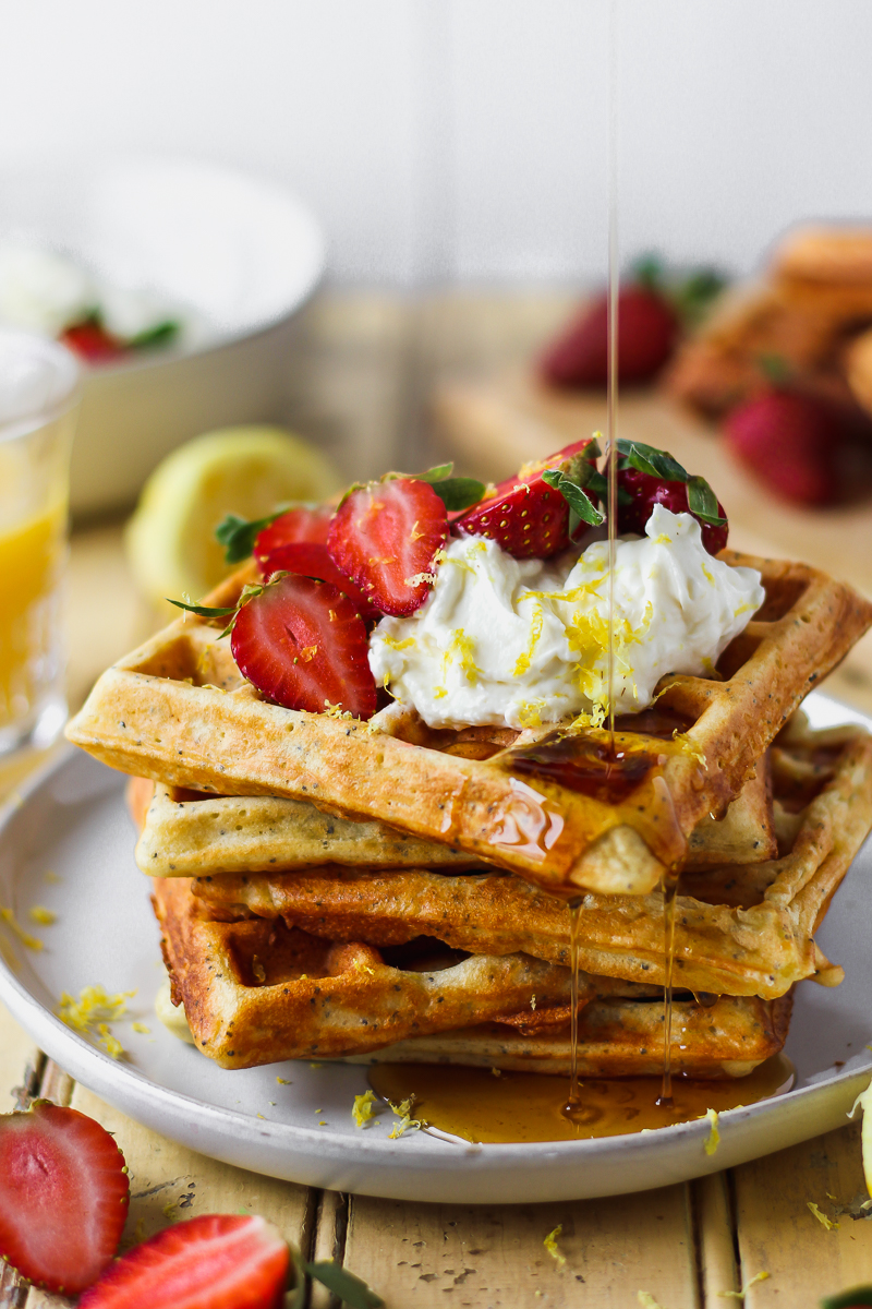 Fluffy on the inside and crisp on the outside, these lemon poppy seed waffles are a definite crowd pleaser! Topped with whipped honey lemon cream that’s bursting with fresh lemon flavor and just the right touch of sweetness. These waffles are like summer in your mouth.