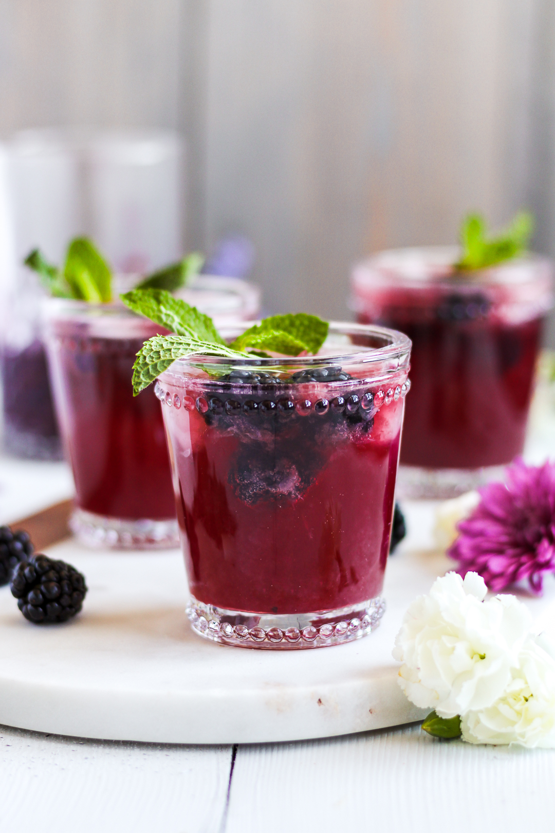 Your new drink of spring and summer! Easy, homemade blackberry ginger simple syrup pairs with lime, vodka and Prosecco creating a tasty and refreshing cocktail that’s perfect for brunch, parties or just any that requires a drink or two. 