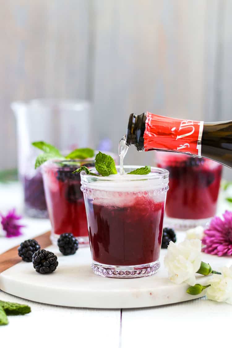 Your new drink of spring and summer! Easy, homemade blackberry ginger simple syrup pairs with lime, vodka and Prosecco creating a tasty and refreshing cocktail that’s perfect for brunch, parties or just any that requires a drink or two. 