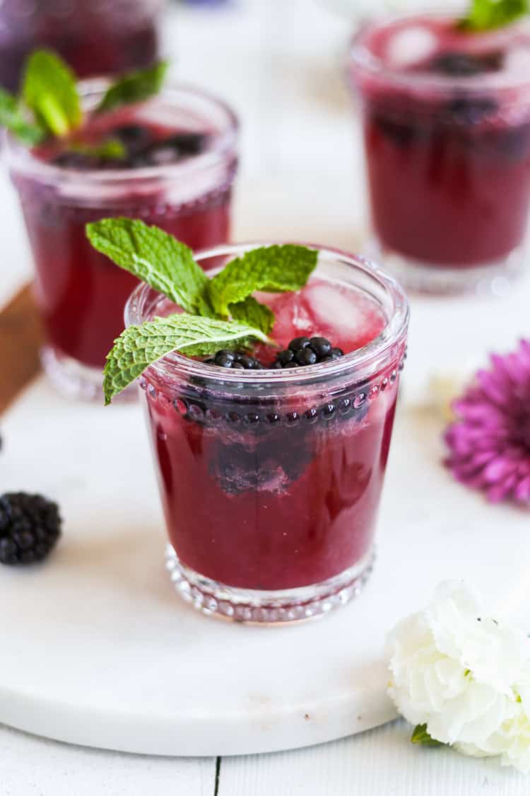 Your new drink of spring and summer! Easy, homemade blackberry ginger simple syrup pairs with lime, vodka and Prosecco creating a tasty and refreshing cocktail that’s perfect for brunch, parties or just any that requires a drink or two.