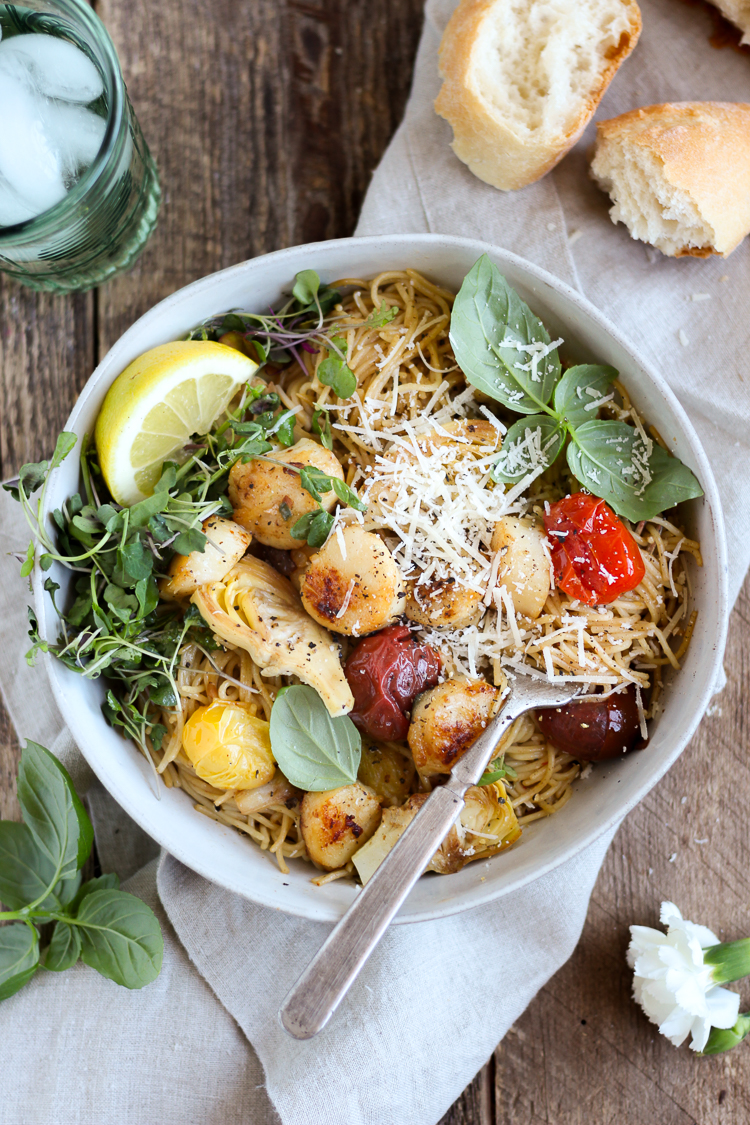 Scallops and artichokes seared in browned butter and tossed with pasta, burst tomatoes and fresh lemon for a light but comforting dinner that’s ready in 30 minutes.