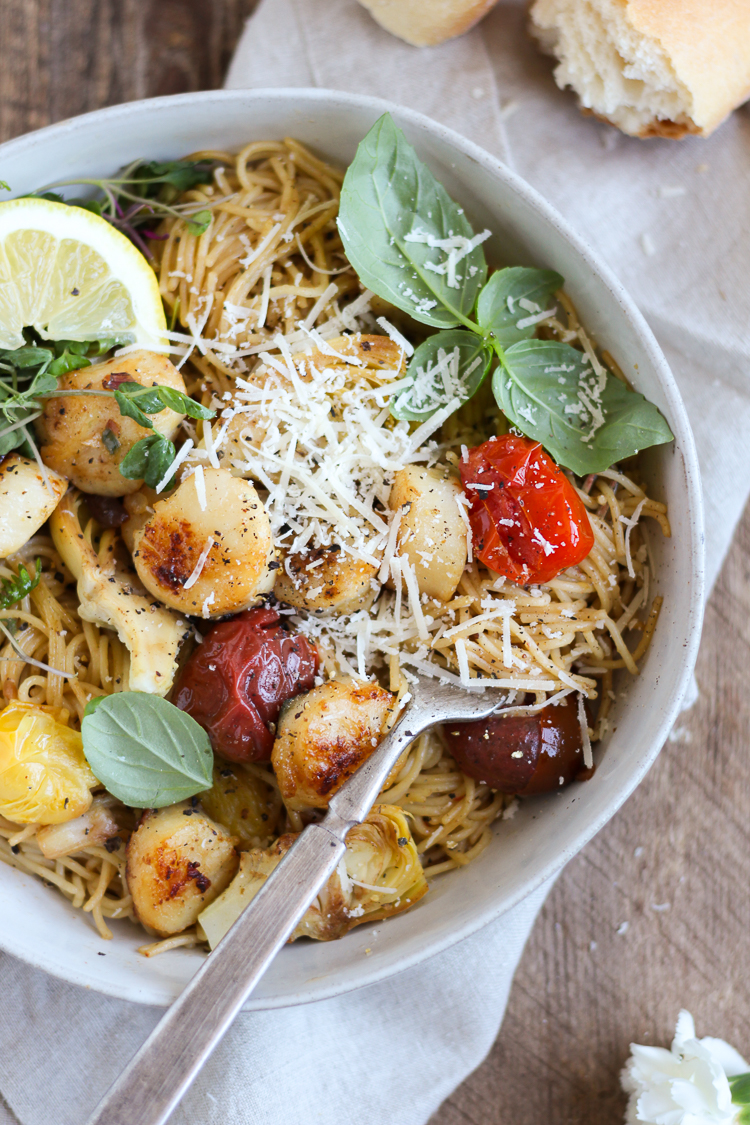Scallops and artichokes seared in browned butter and tossed with pasta, burst tomatoes and fresh lemon for a light but comforting dinner that’s ready in 30 minutes.