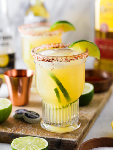 Crisp and refreshing margarita that is perfectly balanced with fresh lemon and lime juice, natural sweetener and tequila then topped off with Corona Extra and served in a glass with a chili-lime salt rim.