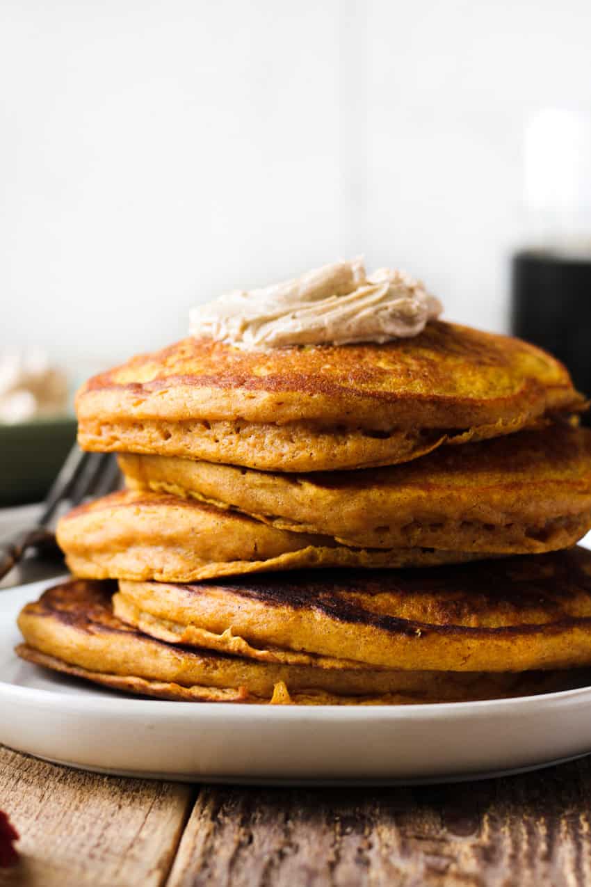 Fluffy pumpkin pancakes with cinnamon honey butter