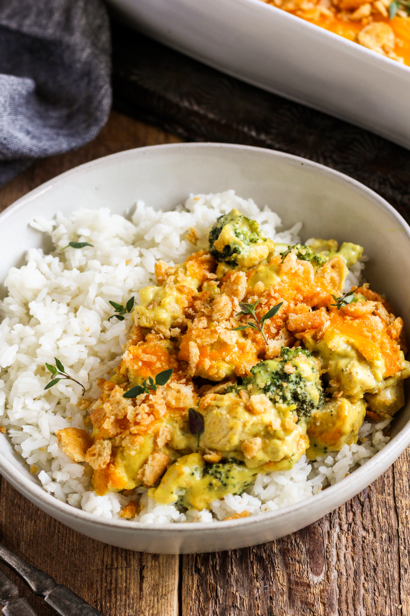curry chicken and broccoli in a bowl over rice