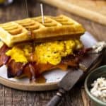 waffle breakfast sandwich with maple syrup drizzle