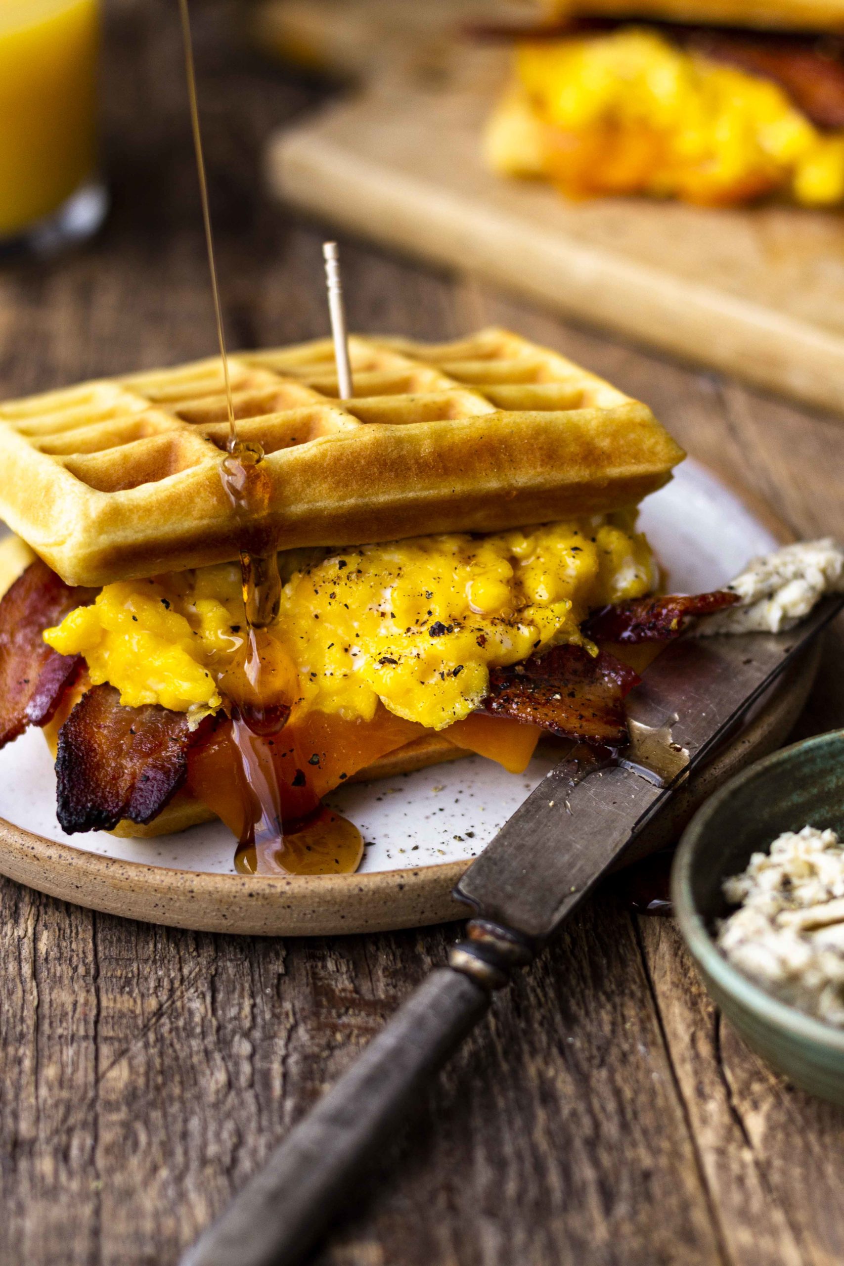 waffle breakfast sandwich with maple syrup drizzle