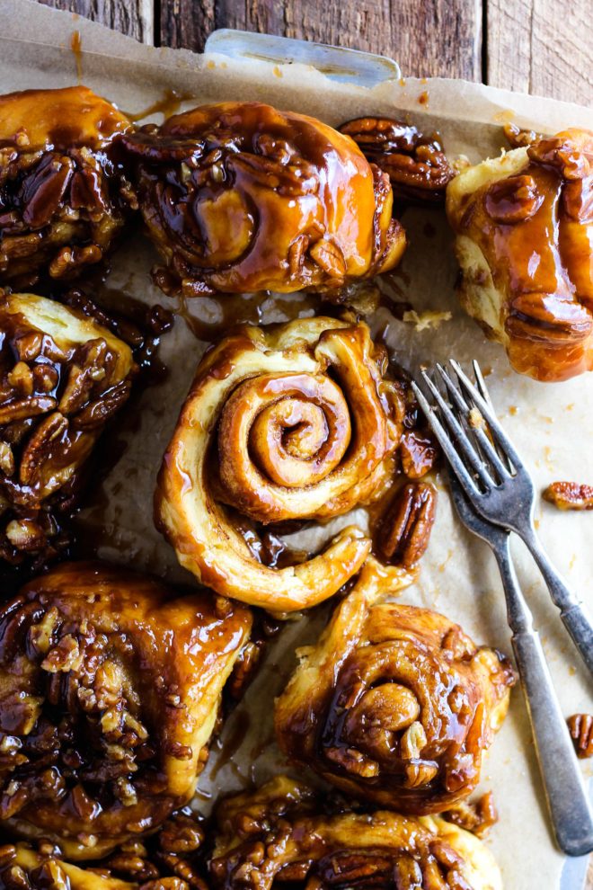 The MOST fluffy, soft, and delicious Caramel Pecan Sticky Buns! Homemade dough sprinkled with cinnamon sugar and baked in gooey caramel pecan sauce. This recipe includes the option to make them overnight so they’re warm and fresh for breakfast.