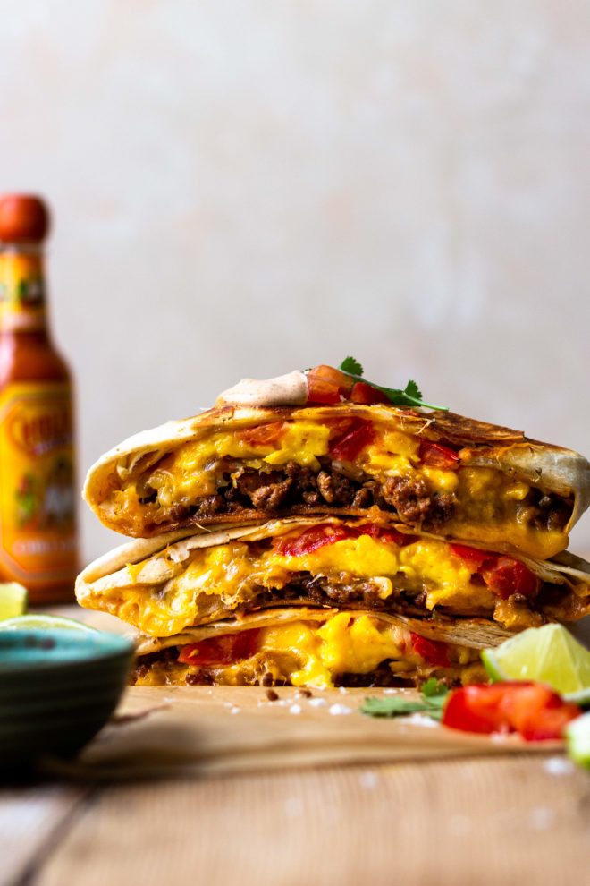 Flour tortilla stuffed with seasoned pork, crispy hash browns, fluffy scrambled eggs, lots of cheese, fresh tomatoes and the MOST delicious Creamy Jalapeño Sauce that tastes just like Taco Bell quesadilla sauce!! Fry the Breakfast Crunchwrap to melty, golden perfection then devour.