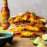 Flour tortilla stuffed with seasoned pork, crispy hash browns, fluffy scrambled eggs, lots of cheese, fresh tomatoes and the MOST delicious Creamy Jalapeño Sauce that tastes just like Taco Bell quesadilla sauce!! Grill the Breakfast Crunchwrap to melty, golden perfection then devour.