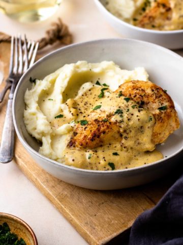 Tender and juicy chicken breasts smothered in the most insanely delicious dijon mustard cream sauce served over fluffy mashed potatoes. The chicken and sauce are all made in one skillet, making it an easy dinner. Perfect for date night or a casual weeknight night. Everyone will love this recipe!