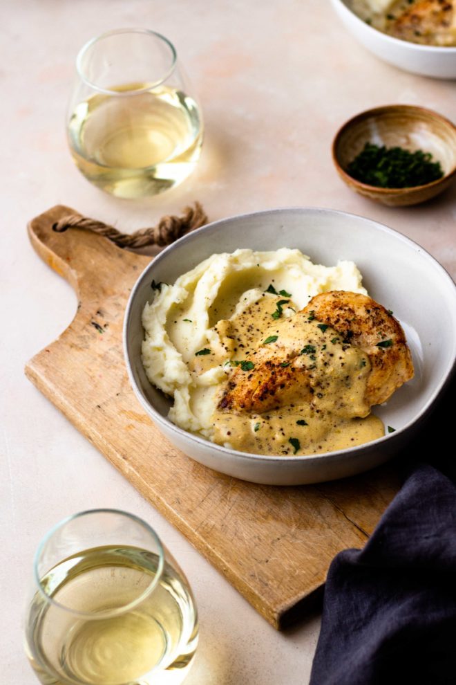 Tender and juicy chicken breasts smothered in the most insanely delicious dijon mustard cream sauce served over fluffy mashed potatoes. The chicken and sauce are all made in one skillet, making it an easy dinner. Perfect for date night or a casual weeknight night. Everyone will love this recipe!