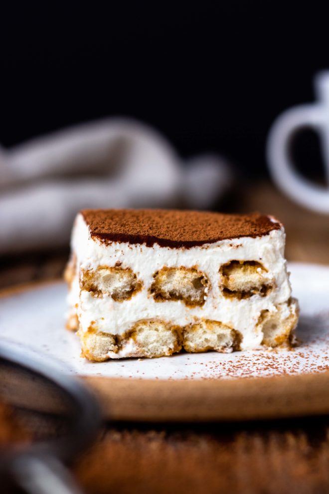 Espresso and coffee liqueur dipped ladyfingers get layered with creamy, fluffy, lightly sweetened mascarpone whipped cream and dusted with rich cocoa powder. This easy, fresh, super delicious no-bake Italian dessert has all the best Tiramisu flavors but without raw eggs.