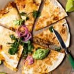 Easy to make and insanely flavorful chipotle chicken, sweet corn, and cheddar cheese tucked between two flour tortillas and grilled to golden, melty perfection. Top with the most delicious, creamy Avocado Lime Crema and lots of fresh garnishes!