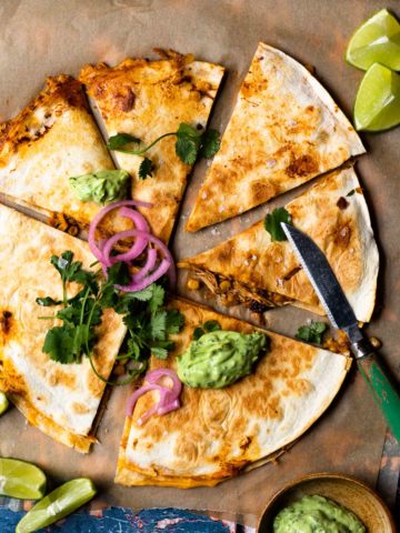 Easy to make and insanely flavorful chipotle chicken, sweet corn, and cheddar cheese tucked between two flour tortillas and grilled to golden, melty perfection. Top with the most delicious, creamy Avocado Lime Crema and lots of fresh garnishes!
