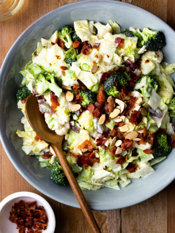 Easy and delicious side salad packed with veggies, bacon, grapes and almonds, then drizzled with a homemade sweet creamy dressing. Both adults and kids devour this salad! It’s perfect for a BBQ or quick weeknight side dish.