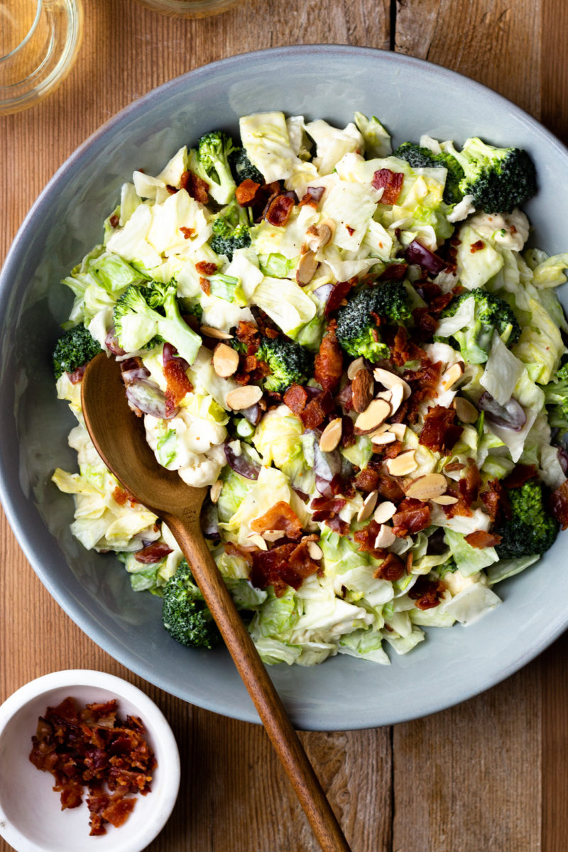 Easy and delicious side salad packed with veggies, bacon, grapes and almonds, then drizzled with a homemade sweet creamy dressing. Both adults and kids devour this salad! It’s perfect for a BBQ or quick weeknight side dish.