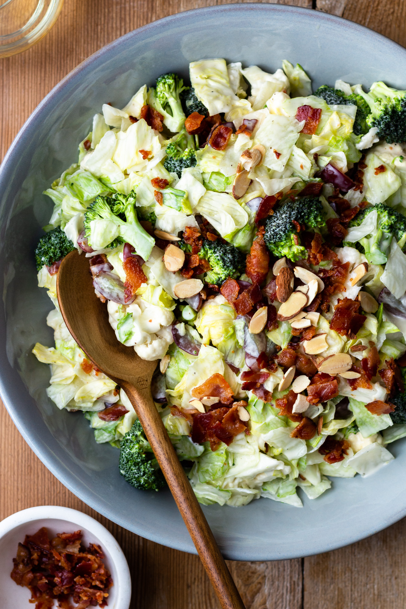 Easy and delicious side salad packed with veggies, bacon, grapes and almonds, then drizzled with a homemade, sweet, creamy dressing. Both adults and kids devour this salad! It’s perfect for a BBQ or quick weeknight side dish. 