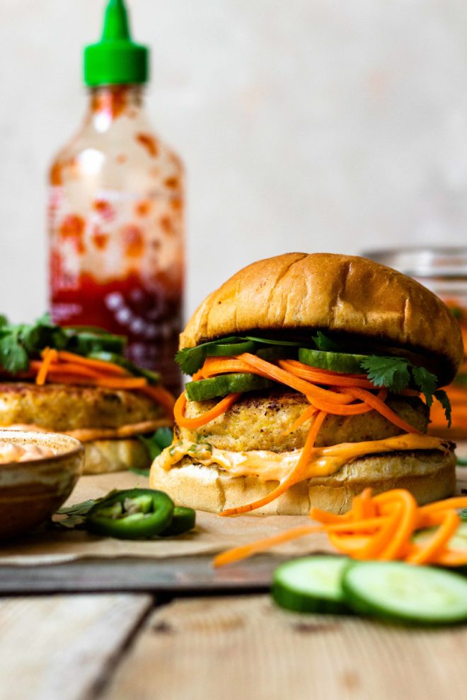 Crave worthy Chicken Banh Mi Burgers that are made with juicy, tender, perfectly seasoned ground chicken and sandwiched between toasted buns then spread with spicy sriracha mayo and topped with crunchy, tangy, quick pickled cucumber, carrot and jalapeño. Finish with fresh cilantro, if desired. The perfect combination!