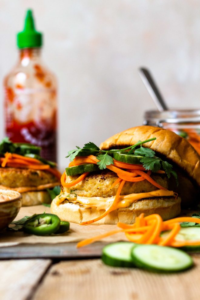 Crave worthy Chicken Banh Mi Burgers that are made with juicy, tender, perfectly seasoned ground chicken and sandwiched between toasted buns then spread with spicy sriracha mayo and topped with crunchy, tangy, quick pickled cucumber, carrot and jalapeño. Finish with fresh cilantro, if desired. The perfect combination!