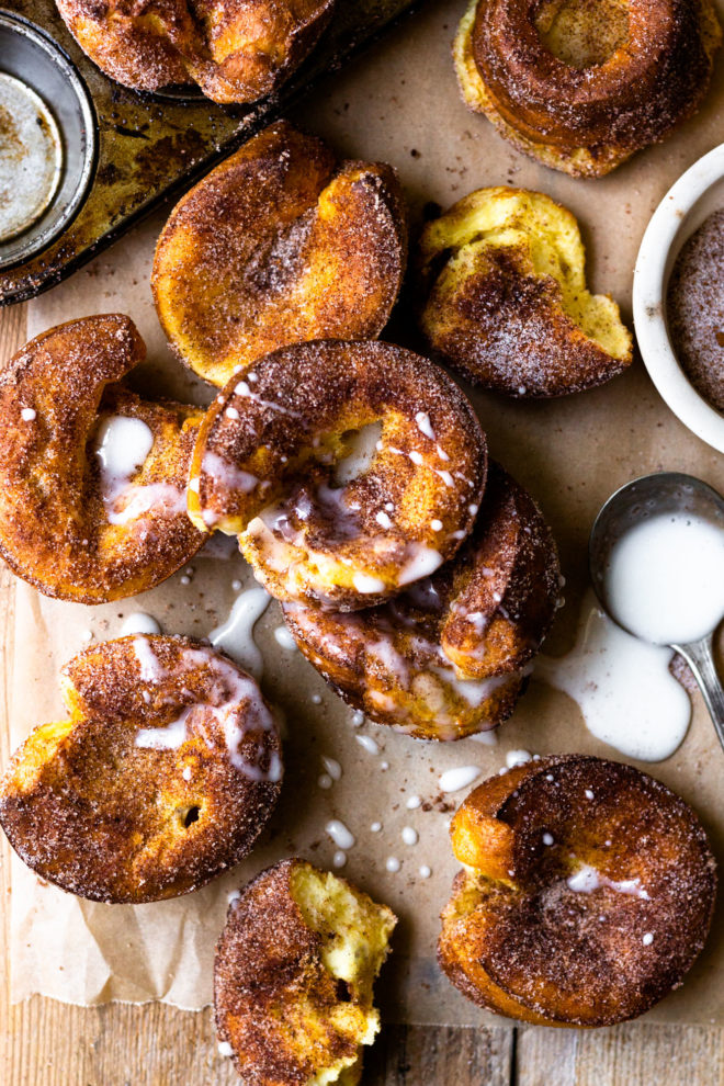 Cinnamon Sugar Churro Popovers are super easy to make and popping with flavor! All you need is 10 minutes to mix up the batter, then bake in a muffin tin until golden, puffed perfection. Brush the warm popovers with butter, sprinkle with cinnamon sugar and serve with homemade vanilla icing. So amazing!!