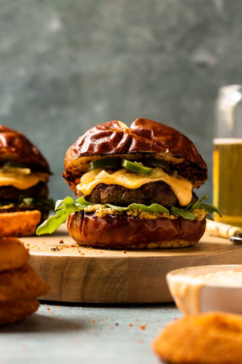 burger with beer cheese and caramelized onions and jalapeños