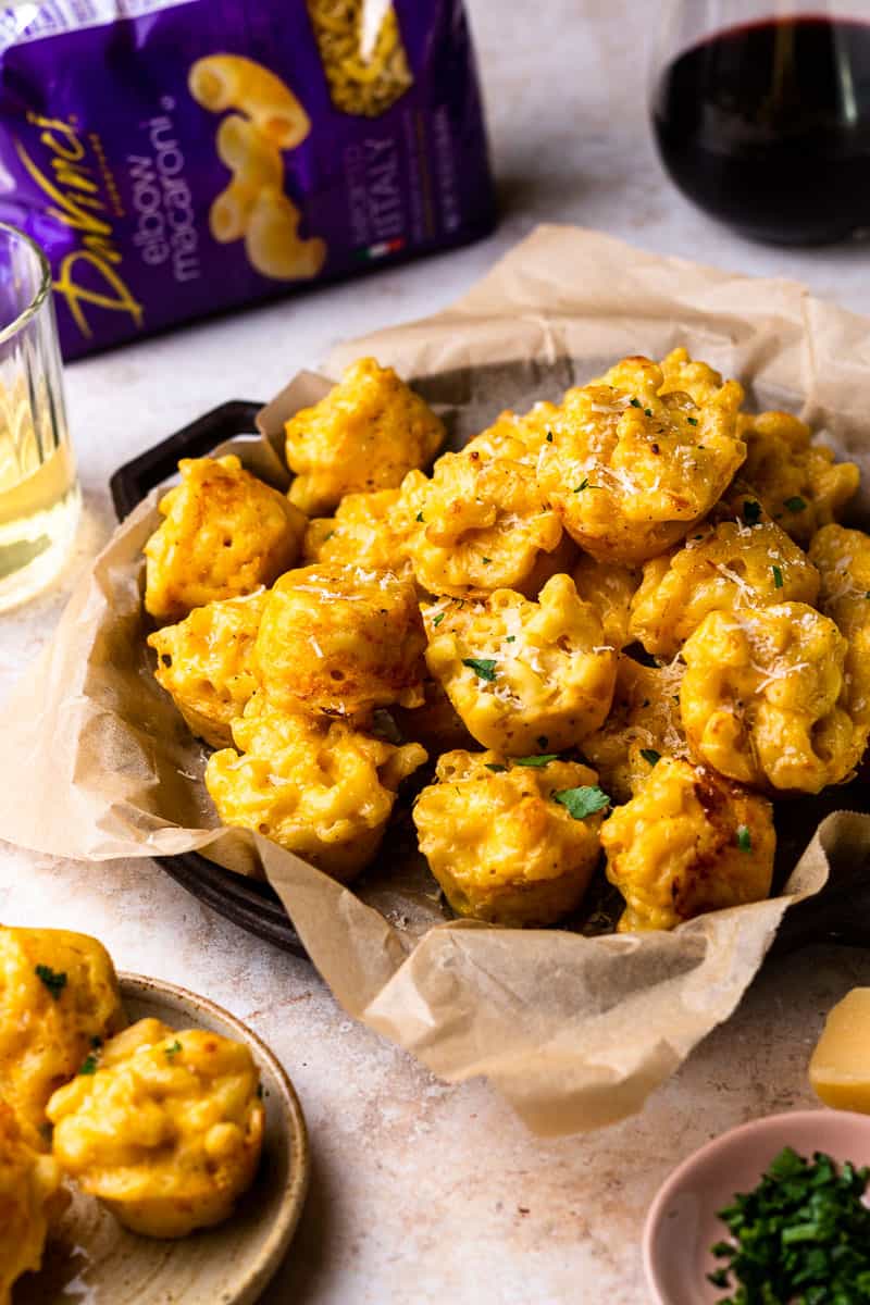 Mac and cheese bites served with wine