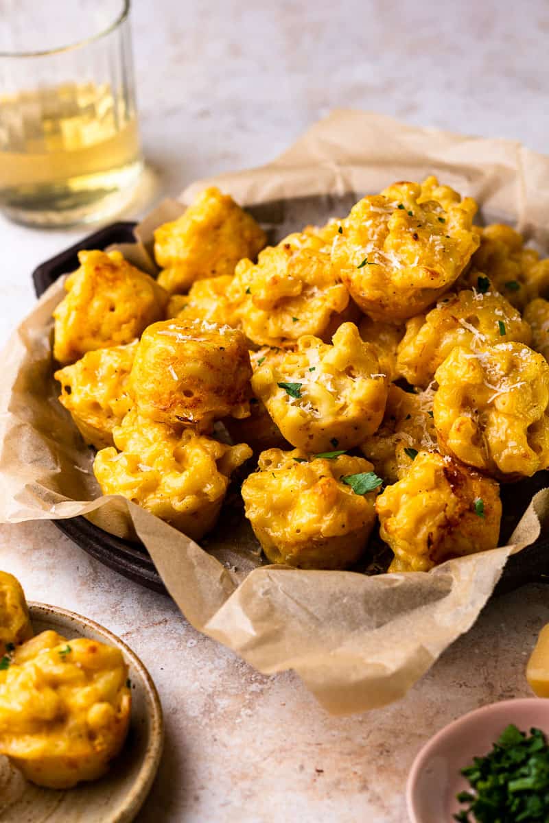 baked mac and cheese bites on a serving platter