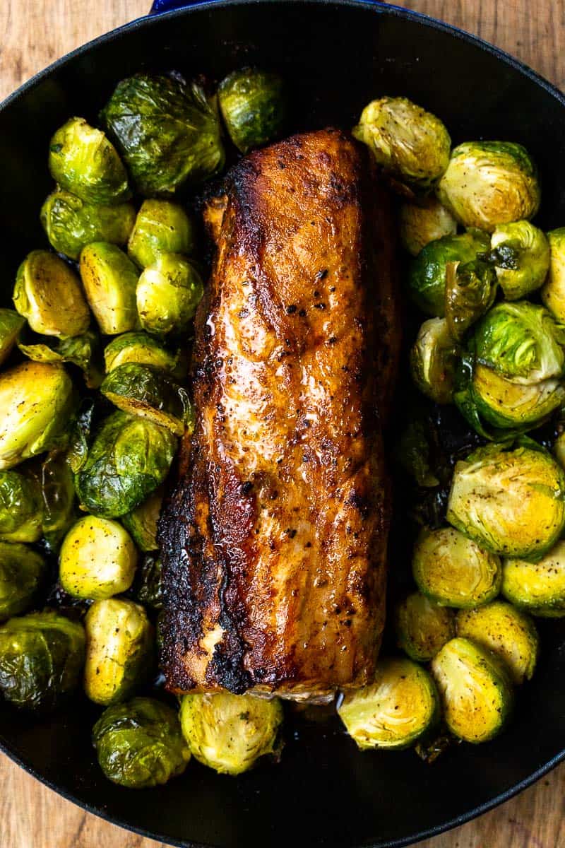 roasted pork tenderloin and brussel sprouts in a cast iron