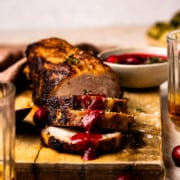 sliced pork tenderloin drizzled with cranberry glaze