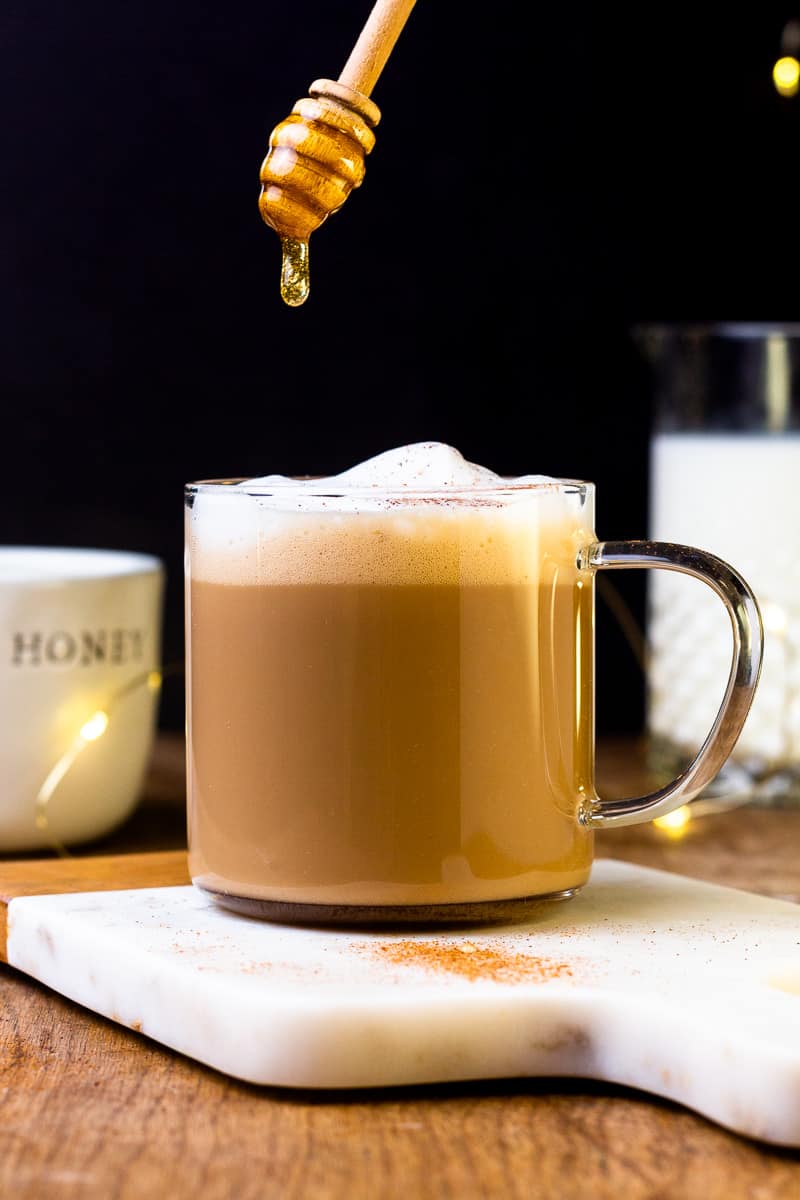 drizzling honey over a hot miel coffee
