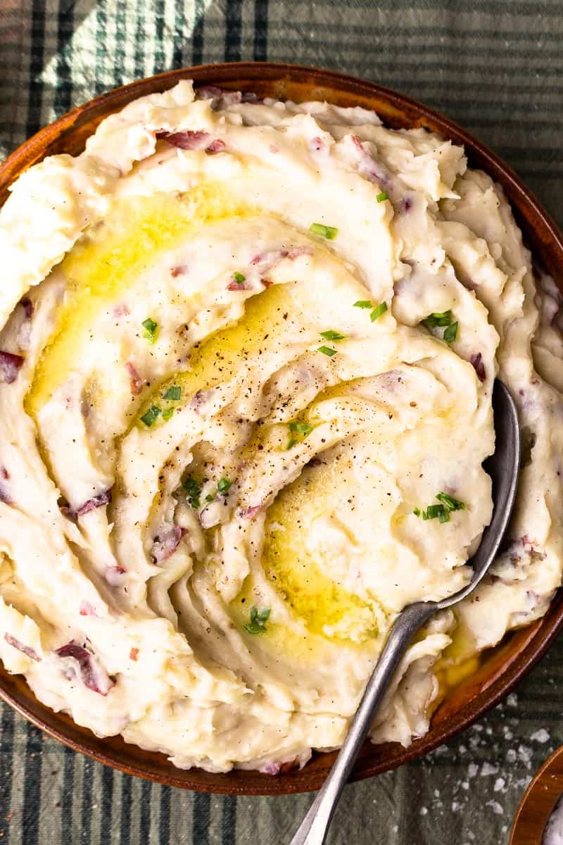 mashed potatoes in serving bowl with a spoon