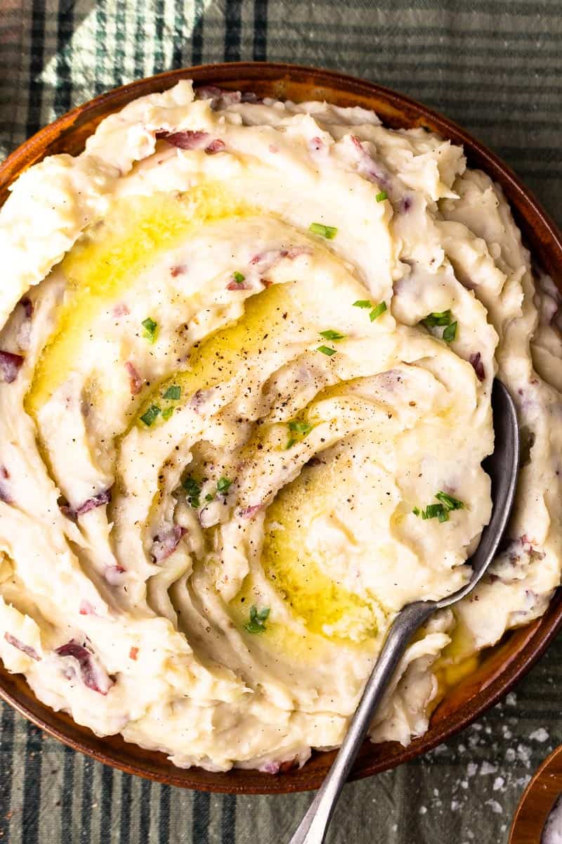 mashed potatoes in serving bowl with a spoon