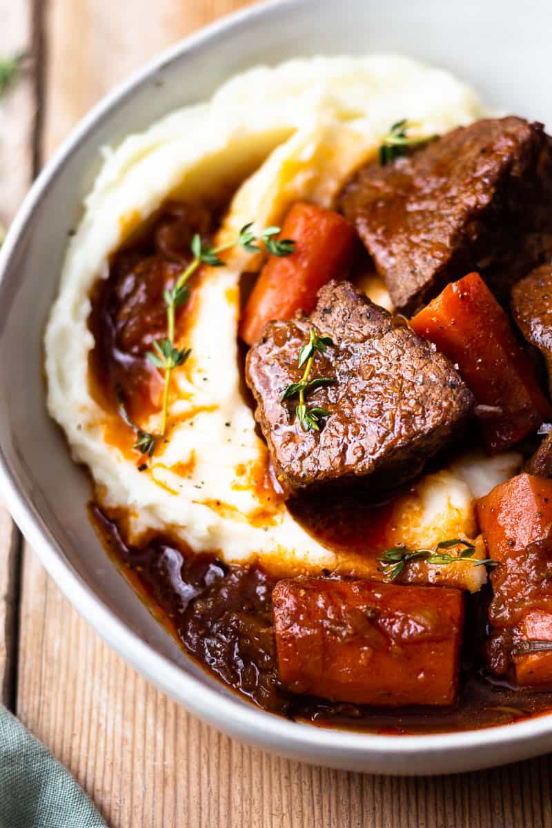 chunks of venison roast in a bowl with carrots
