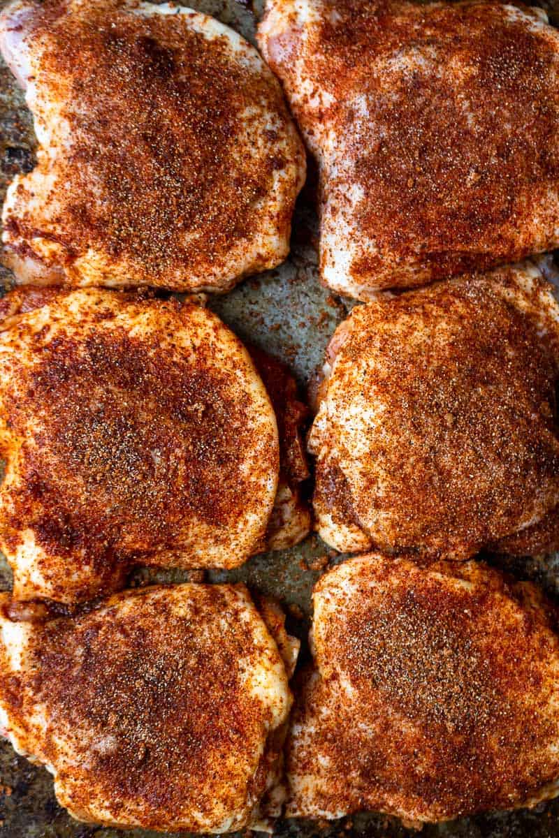 raw chicken thighs with dry rub