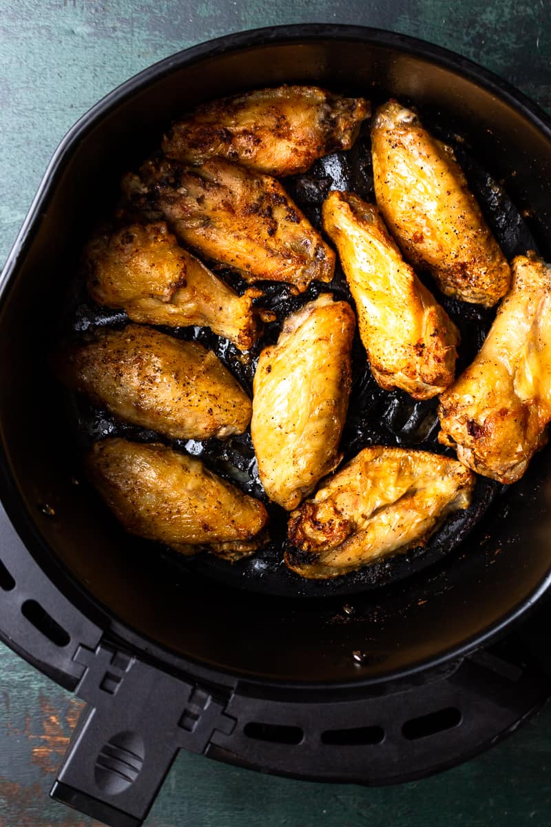 cooked chicken wings in the air fryer basket