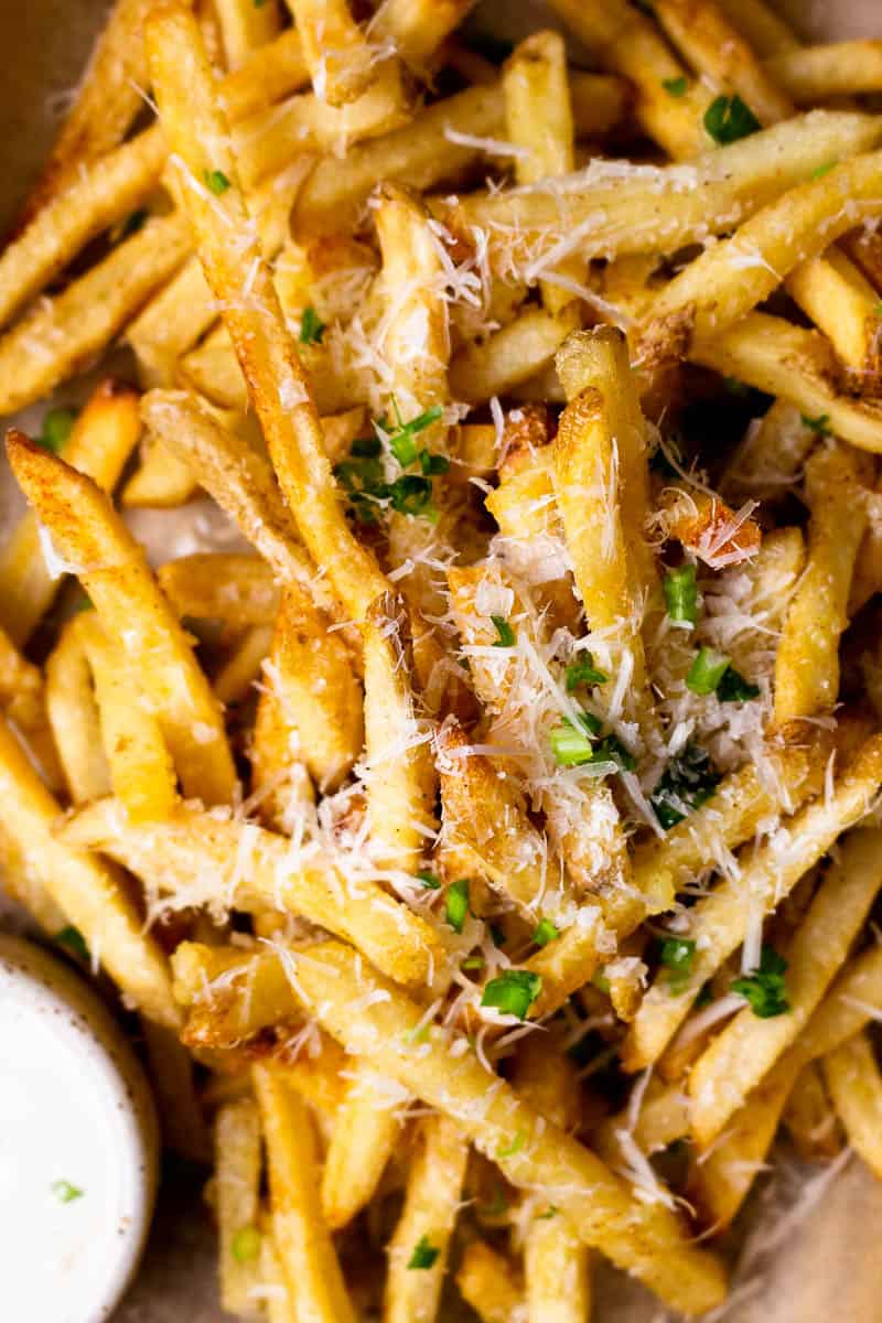fries topped with parmesan cheese and chives